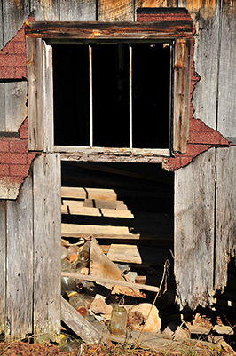 Abandoned barn with rusty windows photo